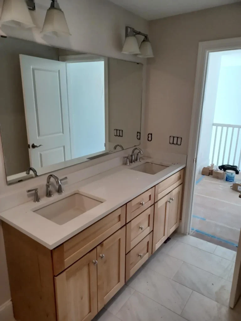 Custom double vanity with wood cabinets in a bathroom
